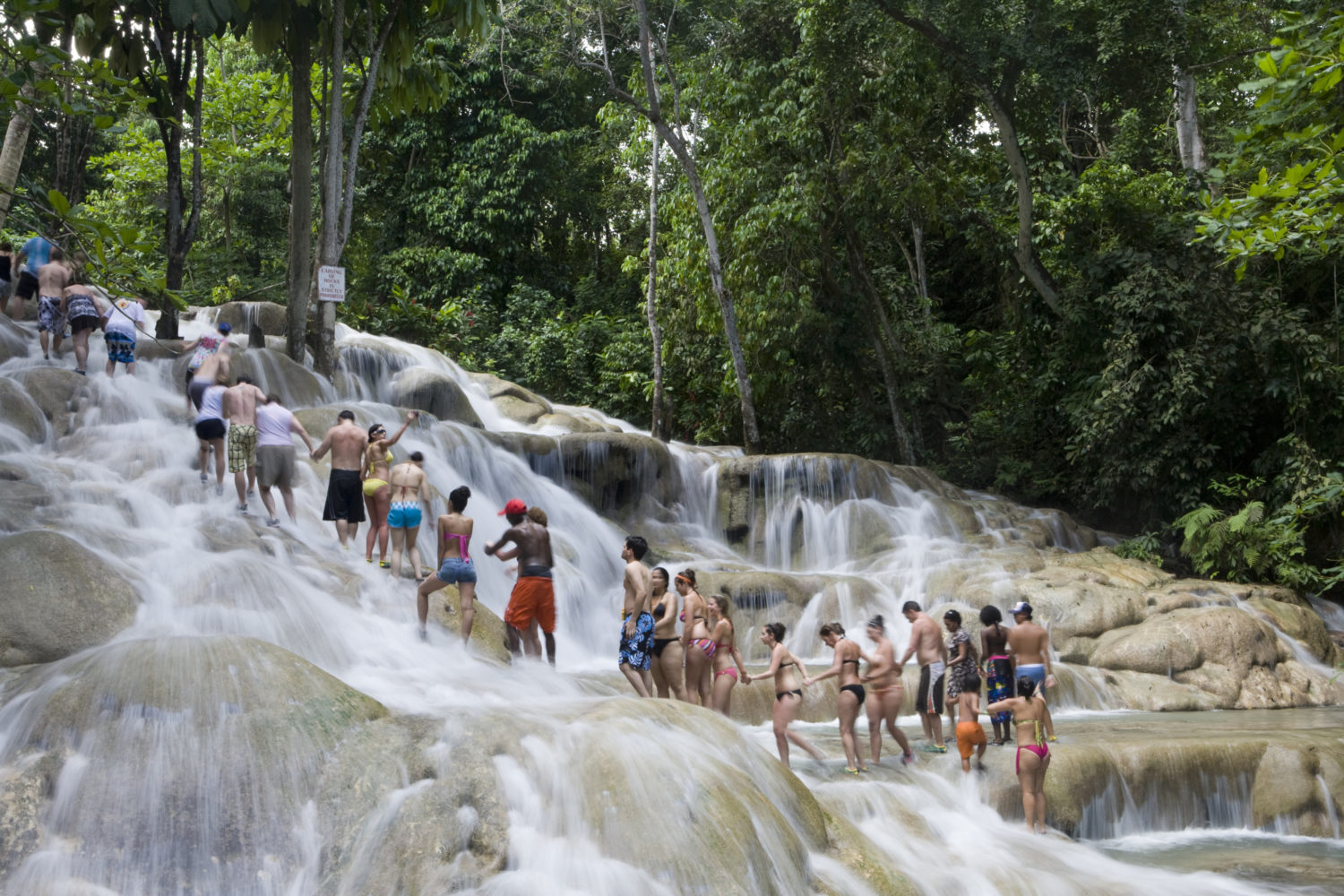 Tourists climbing the famous Dunn's River Falls in Ocho Rios