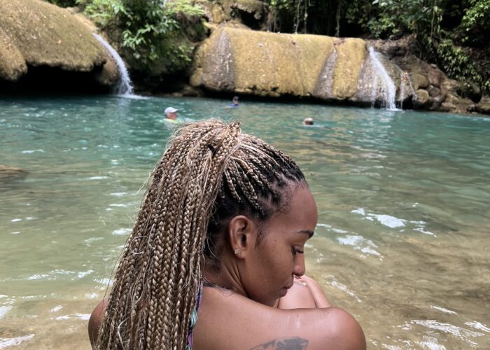 Easy Vibes Exclusive Tours client enjoying Ys Falls
